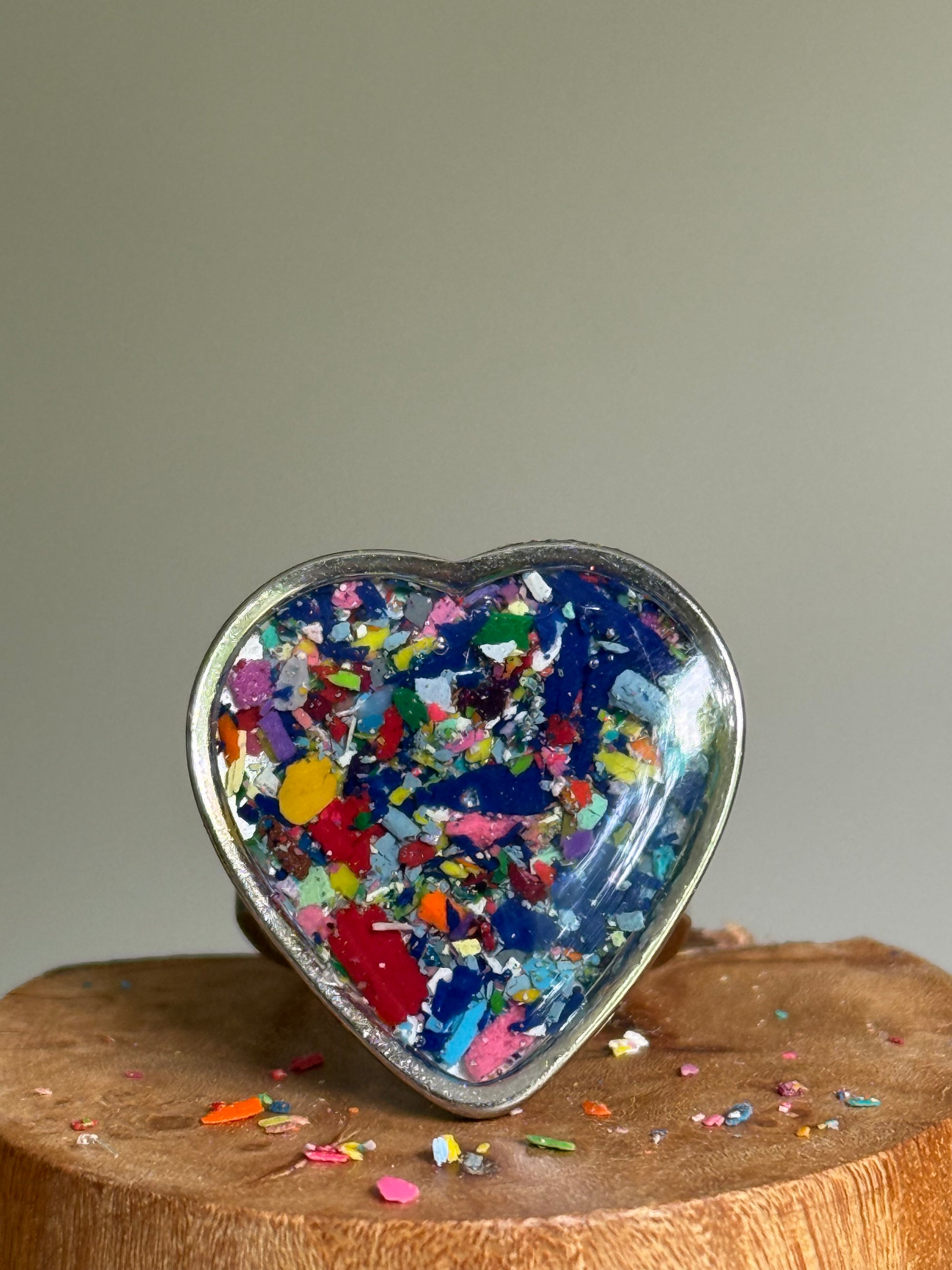 Handcrafted large heart-shaped ring made with recycled crayons, featuring lots of navy and cobalt hues. Made by mother-daughter studio in Atlanta, GA.  It's crayon jewelry by crayonfetti.
