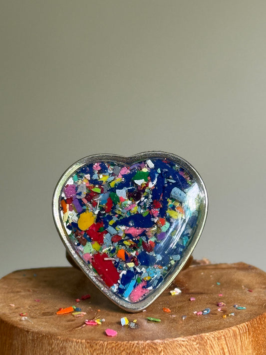 Handcrafted large heart-shaped ring made with recycled crayons, featuring lots of navy and cobalt hues. Made by mother-daughter studio in Atlanta, GA.  It's crayon jewelry by crayonfetti.