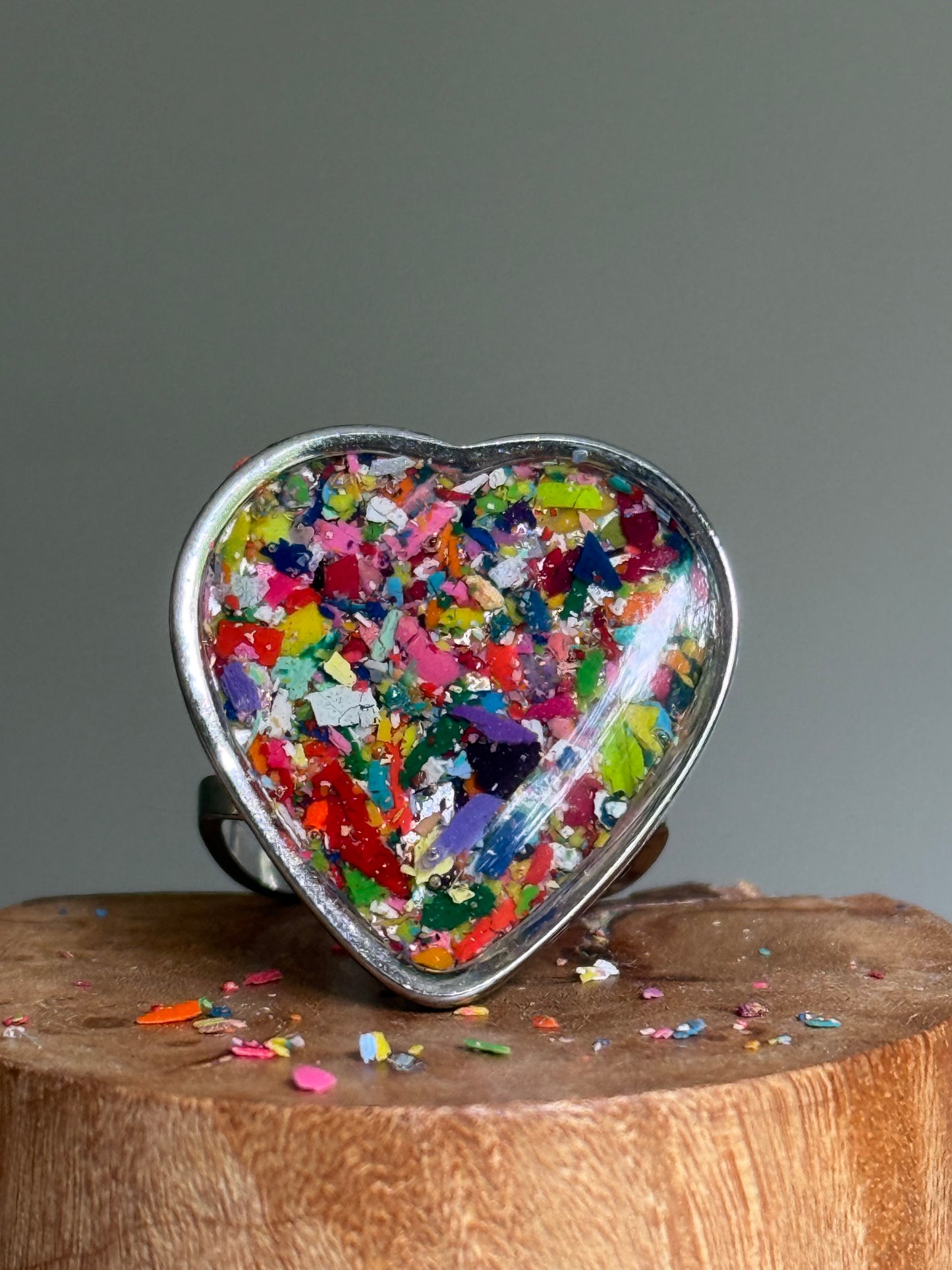 heart-shaped ring filled with colorful multicolor crayons.  crayonfetti crayon jewelry by mother daughter based in atlanta, ga