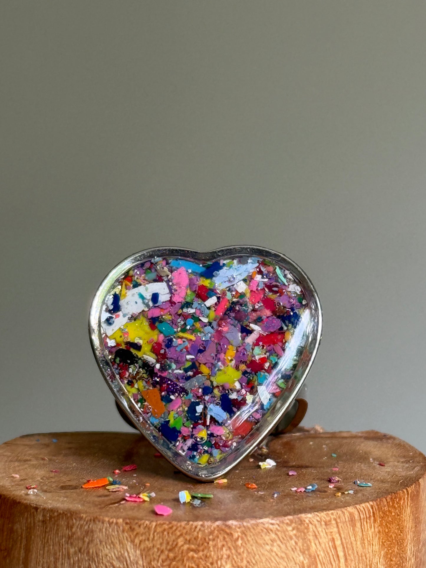 Handcrafted large heart-shaped ring made with recycled crayons, featuring lots of purple colors. Made by mother-daughter studio in Atlanta, GA.  It's crayon jewelry by crayonfetti.