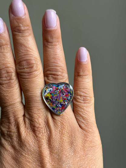 Handcrafted large heart-shaped ring made with recycled crayons, featuring lots of purple colors. Made by mother-daughter studio in Atlanta, GA.  It's crayon jewelry by crayonfetti.