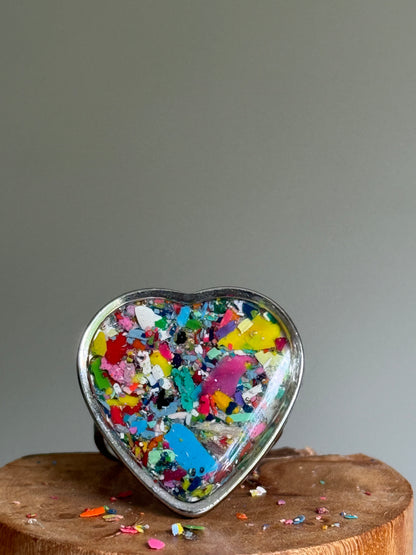 Handcrafted large heart-shaped ring made with recycled crayons, featuring a polished and sophisticated silhouette. Made by mother-daughter studio in Atlanta, GA.  It's crayon jewelry.
