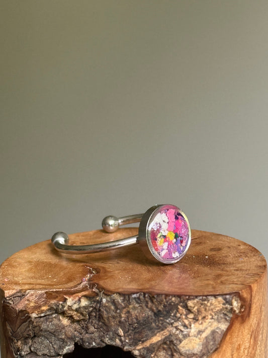 Handcrafted minimalist ring featuring a dreamy mosaic of pastel and white crayon shavings set in a tarnish-resistant stainless steel bezel.
