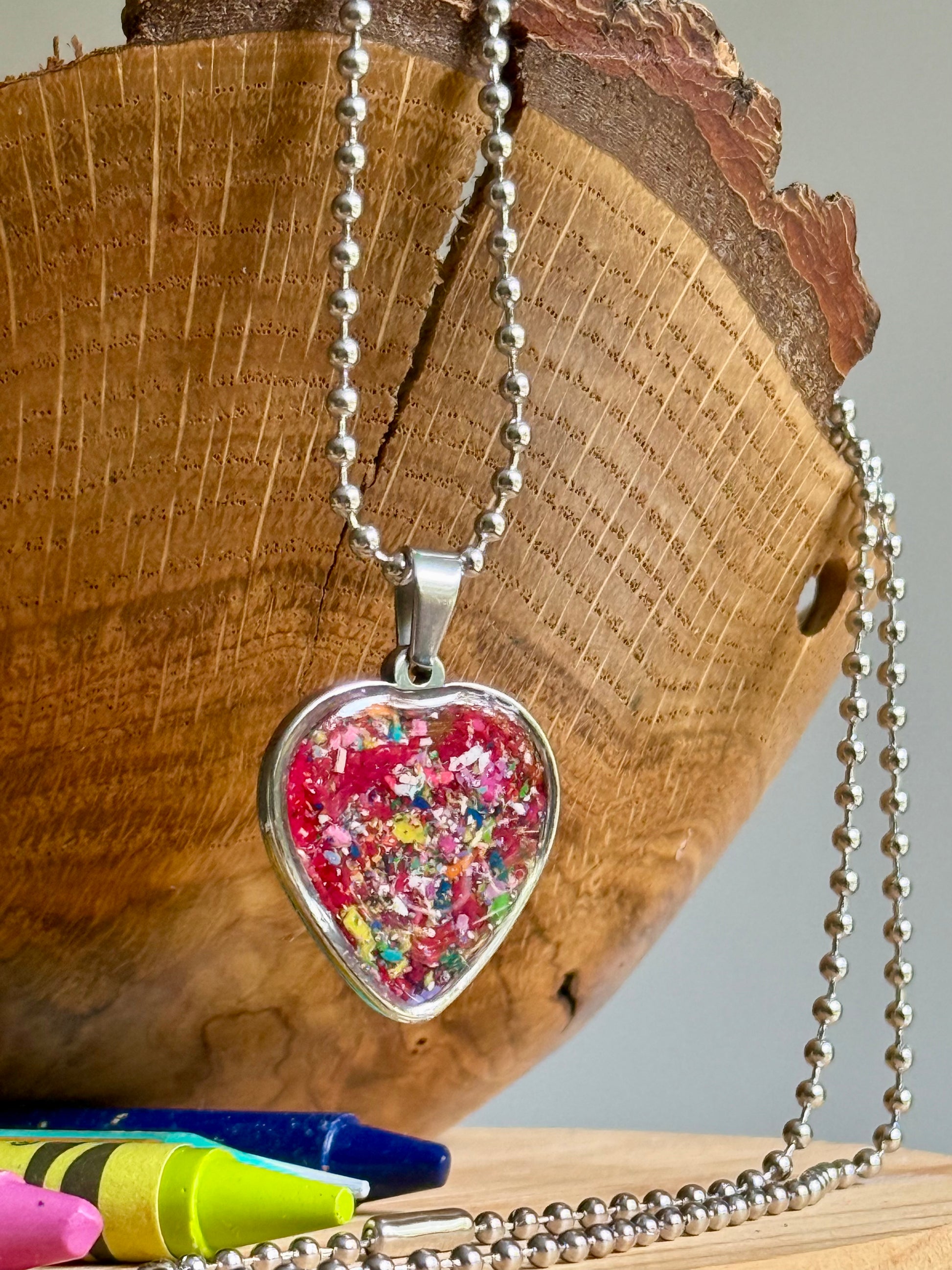 stainless steel heart filled with colorful crayons.  crayon jewelry by crayonfetti