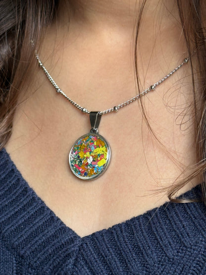 Stainless steel pendant with hand placed crayons.  Crayon Jewelry