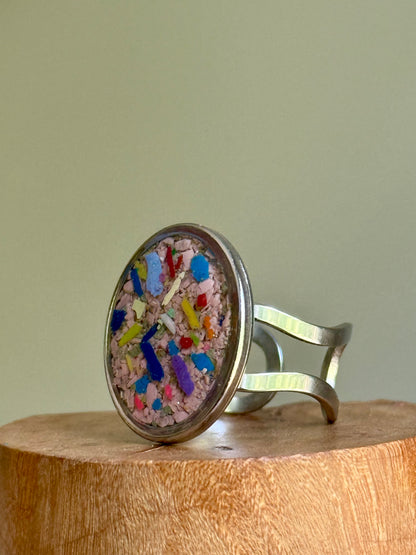oval ring filed with crayons by mother-daughter duo.  Crayonfetti