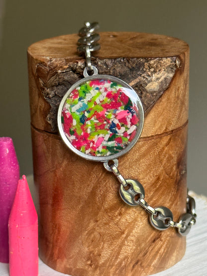 Hypoallergenic stainless steel bracelet with colorful reclaimed crayons.