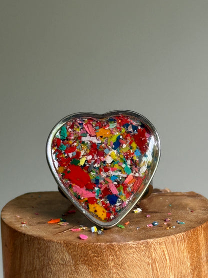 Handcrafted large heart-shaped ring made with recycled crayons, featuring a polished and sophisticated silhouette. Made by mother-daughter studio in Atlanta, GA.  It's crayon jewelry.