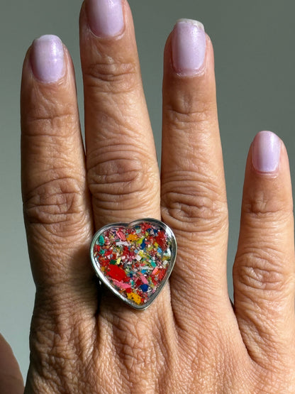Handcrafted large heart-shaped ring made with recycled crayons, featuring a polished and sophisticated silhouette. Made by mother-daughter studio in Atlanta, GA.  It's crayon jewelry.