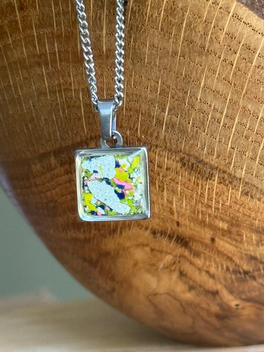 Sunlight square crayon jewelry necklace featuring metallic white, navy, and yellow reclaimed crayon shavings in a handmade pendant. crayon jewelry by crayonfetti