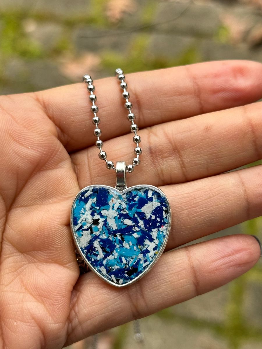 heart pendant filled with blue crayon shavings by crayonfetti