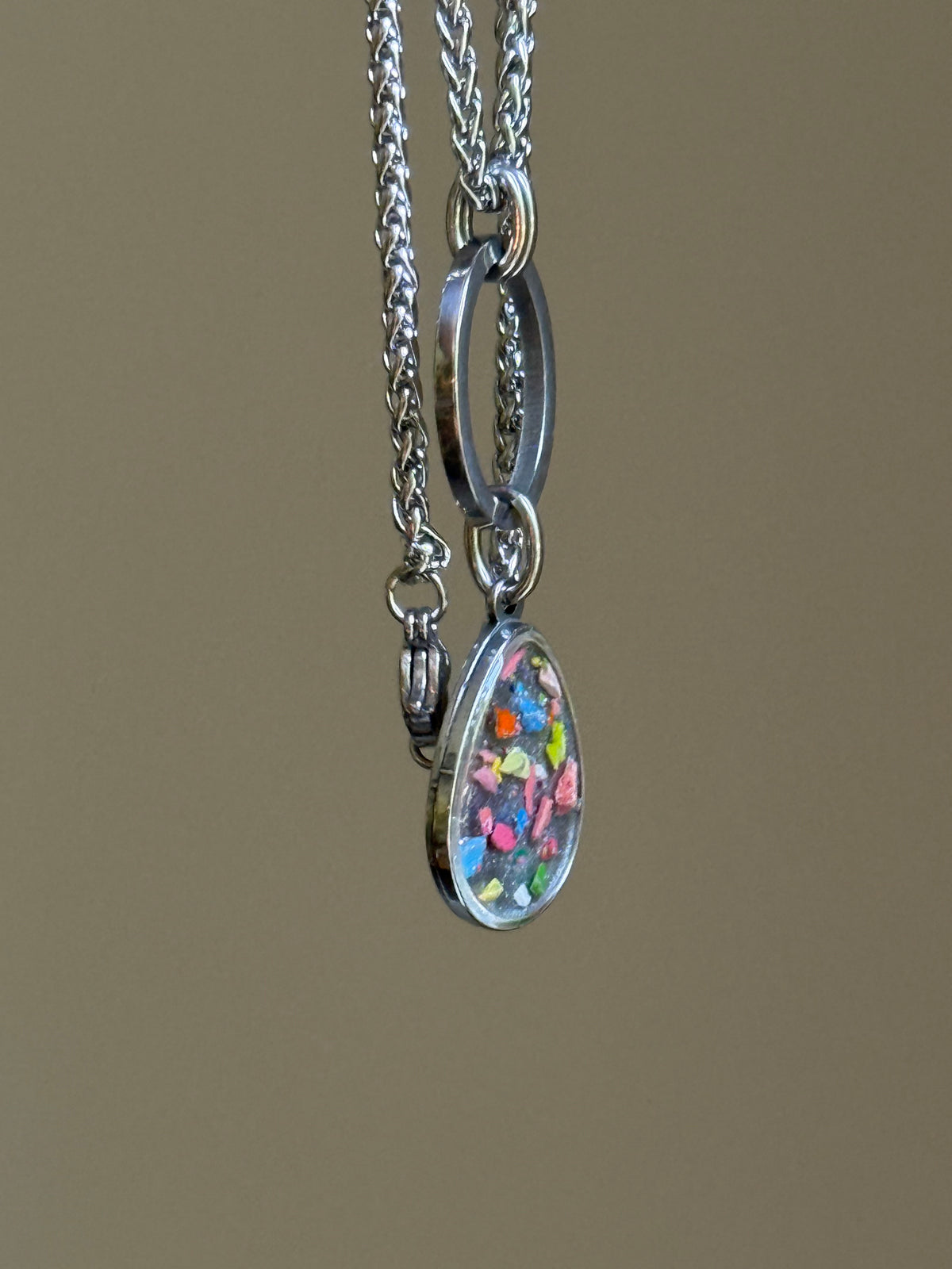 Full-length view of the Clearly Colorful multi-crayon pendant necklace displaying chain drop and proportion.