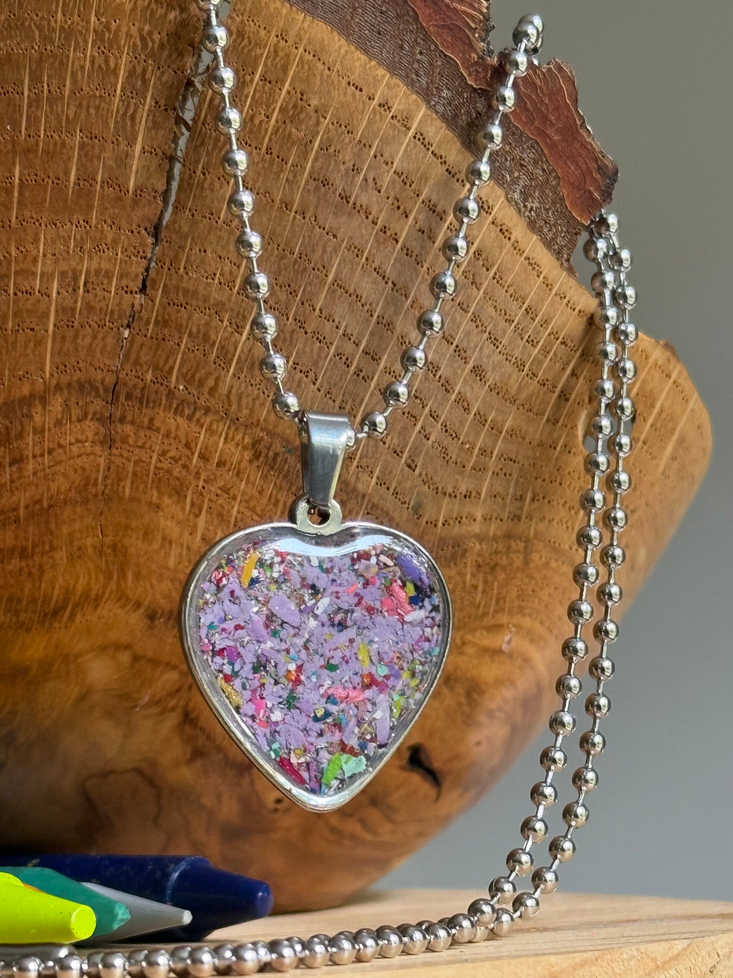 stainless steel heart shaped pendant filled with crayons.  crayon jewelry by crayonfetti, mother-daughter, kalen redmon
