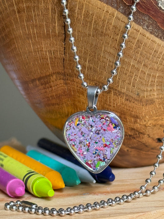 stainless steel heart shaped pendant filled with crayons.  crayon jewelry by crayonfetti