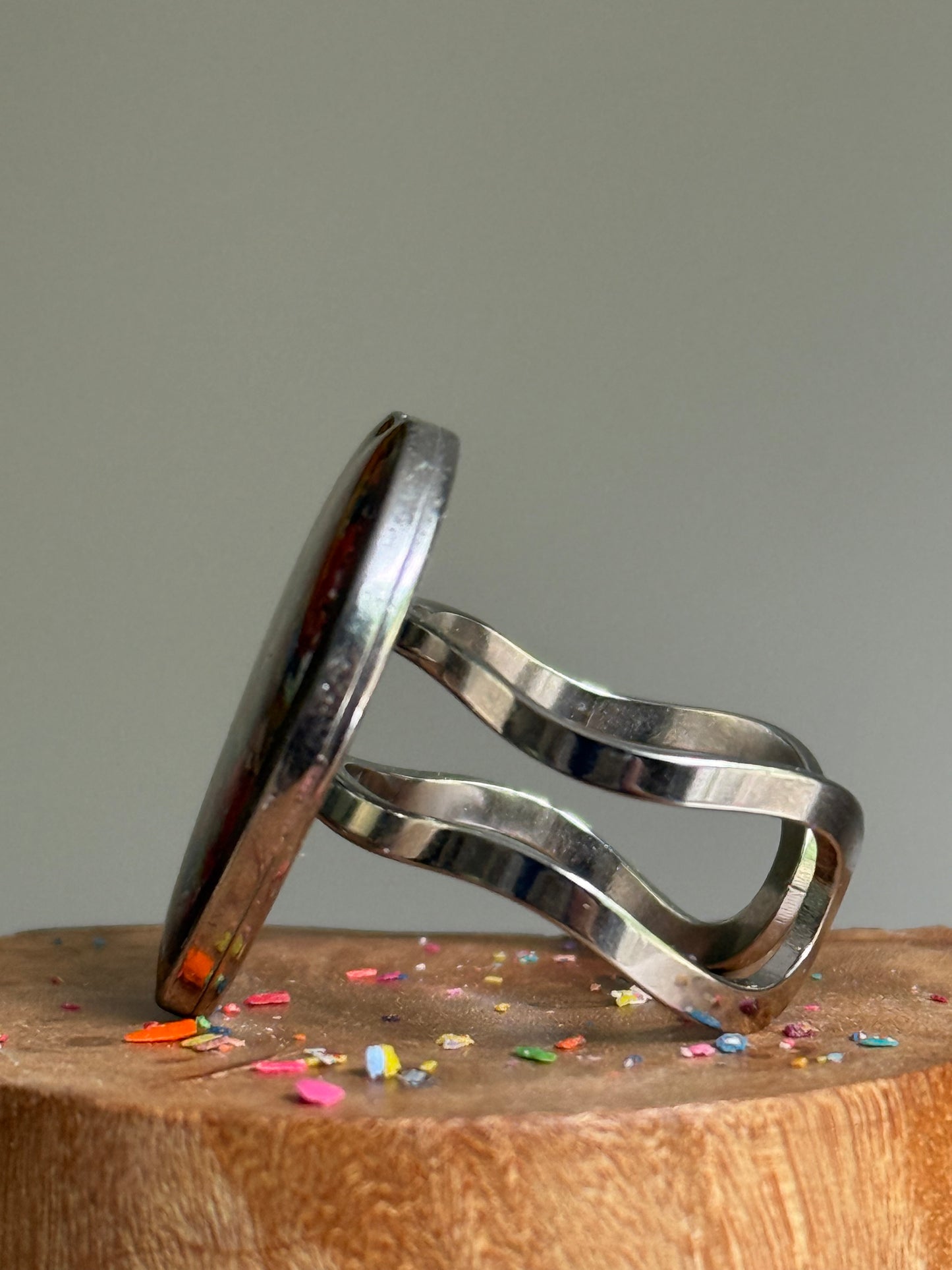 Handcrafted large heart-shaped ring made with recycled crayons, featuring a polished and sophisticated silhouette. Made by mother-daughter studio in Atlanta, GA.  It's crayon jewelry.