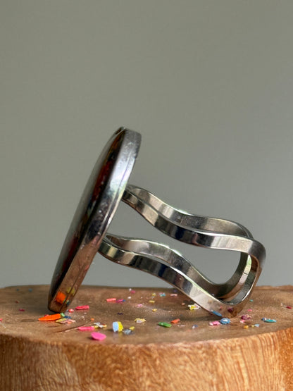 Handcrafted large heart-shaped ring made with recycled crayons, featuring a polished and sophisticated silhouette. Made by mother-daughter studio in Atlanta, GA.  It's crayon jewelry.