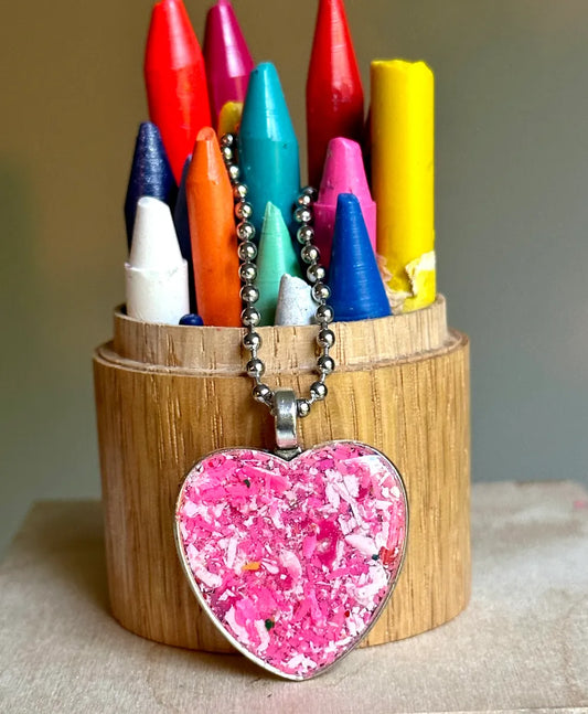 heart pendant filled with pink crayon shavings by crayonfetti