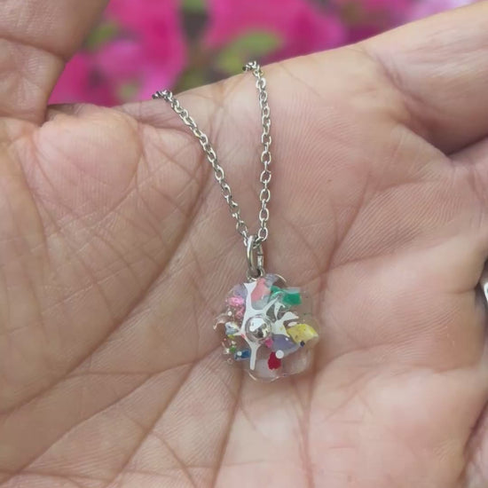 clear flower pendant handcrafted with crayons.  Chain included.  Crayonfetti crayon jewelry by mother daughter based in Atlanta