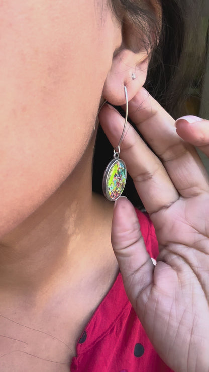 Our Prisma earrings are handcrafted with recycled crayons. Lightweight and colorful statement earrings. A vibrant and joyful sustainable jewelry statement from our mother-daughter studio in Atlanta, GA.