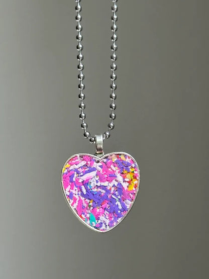 heart pendant filled with crayon shavings by crayonfetti