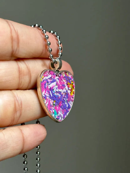 heart pendant filled with crayon shavings by crayonfetti