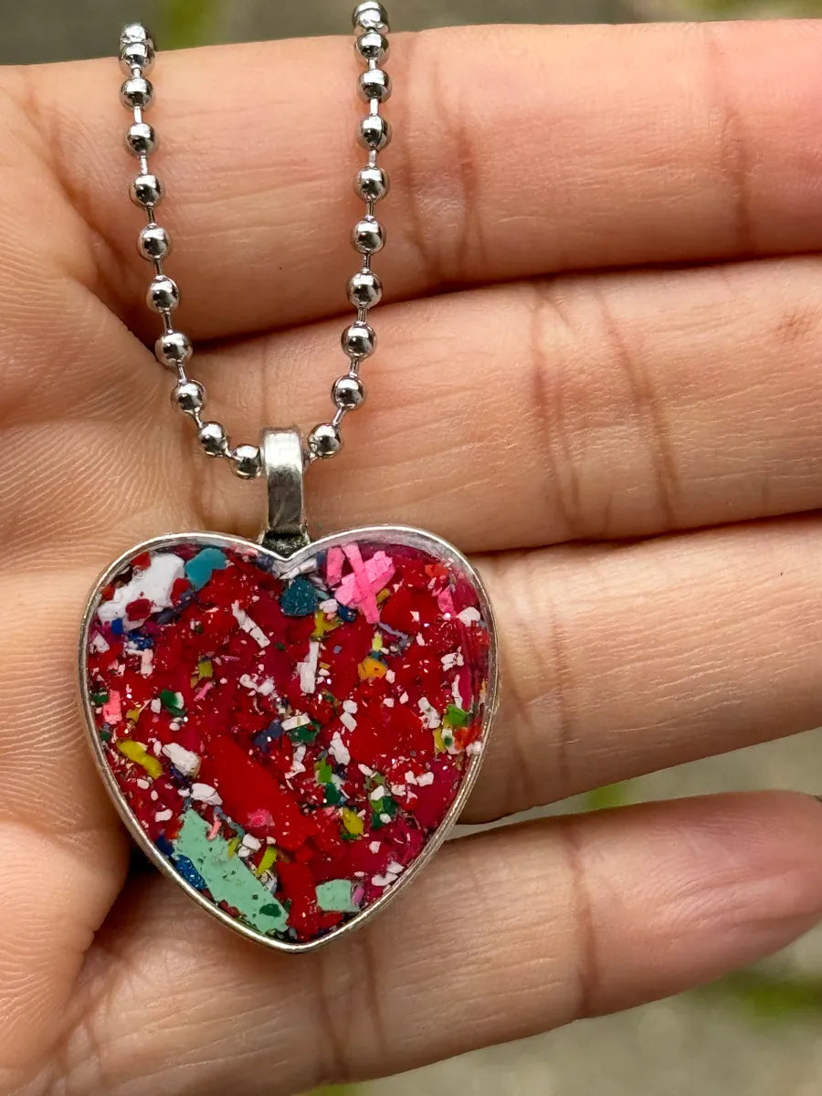 heart pendant filled with crayon shavings by crayonfetti